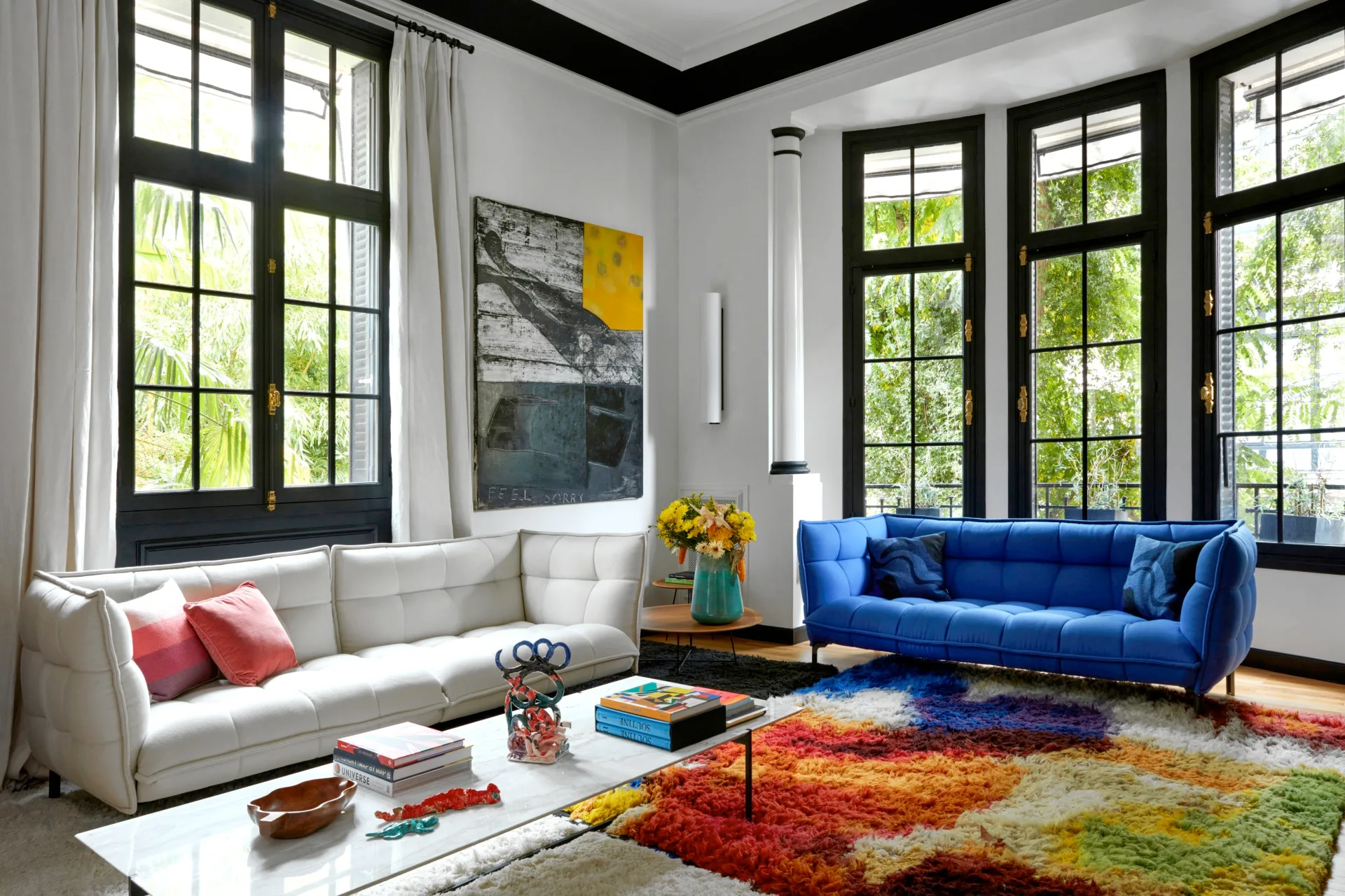 art-deco-parisian-mansion-colourful-rug-blue-couch