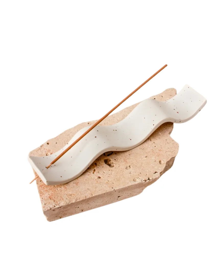 A wavy ceramic incense holder from Commonfolk Collective