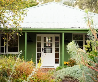 green country home with white front door