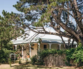 The exterior of a white cottage in Murrurundi, NSW