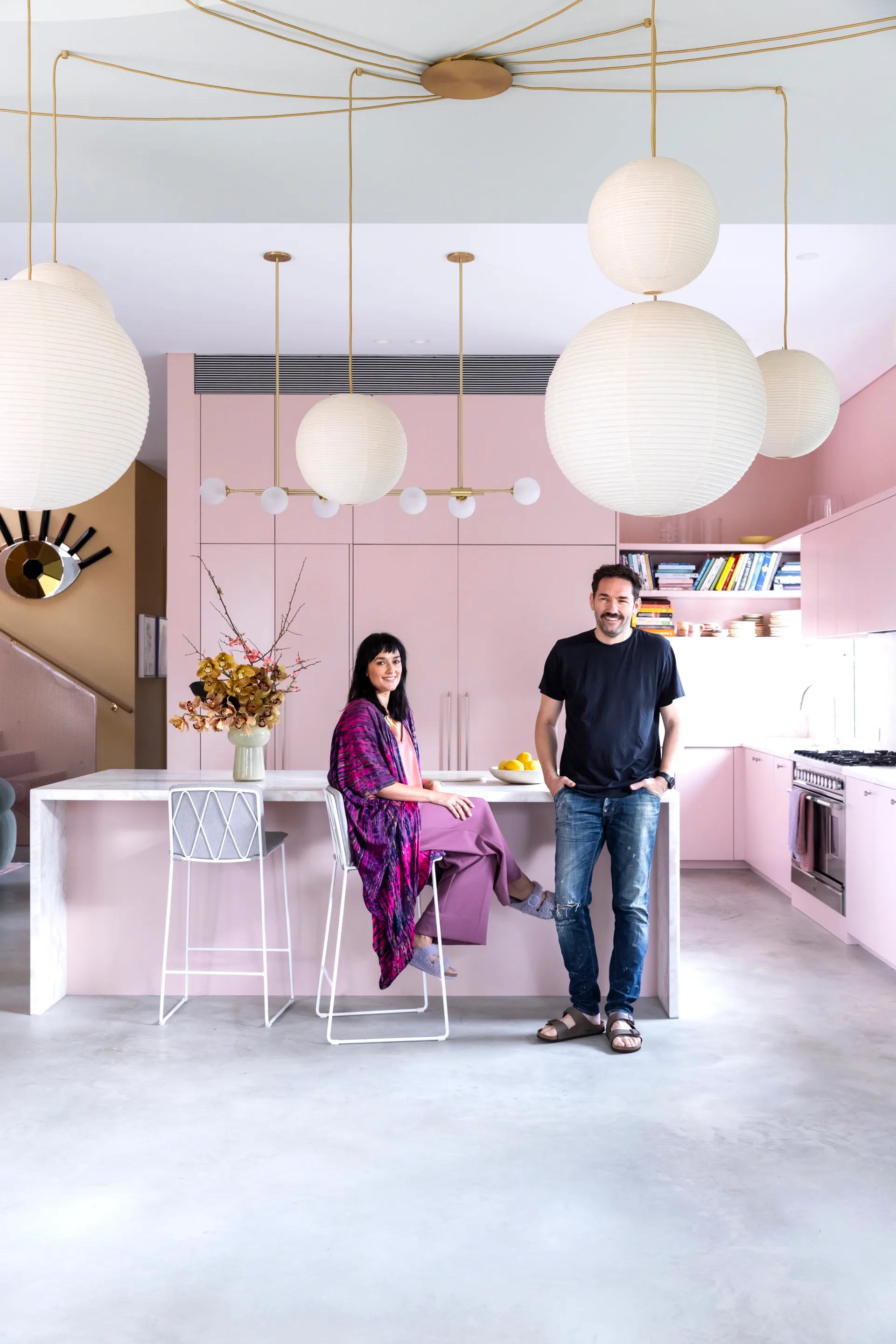 Artist Carla Ruffino with husband Nash Edgerton in their pink kitchen 