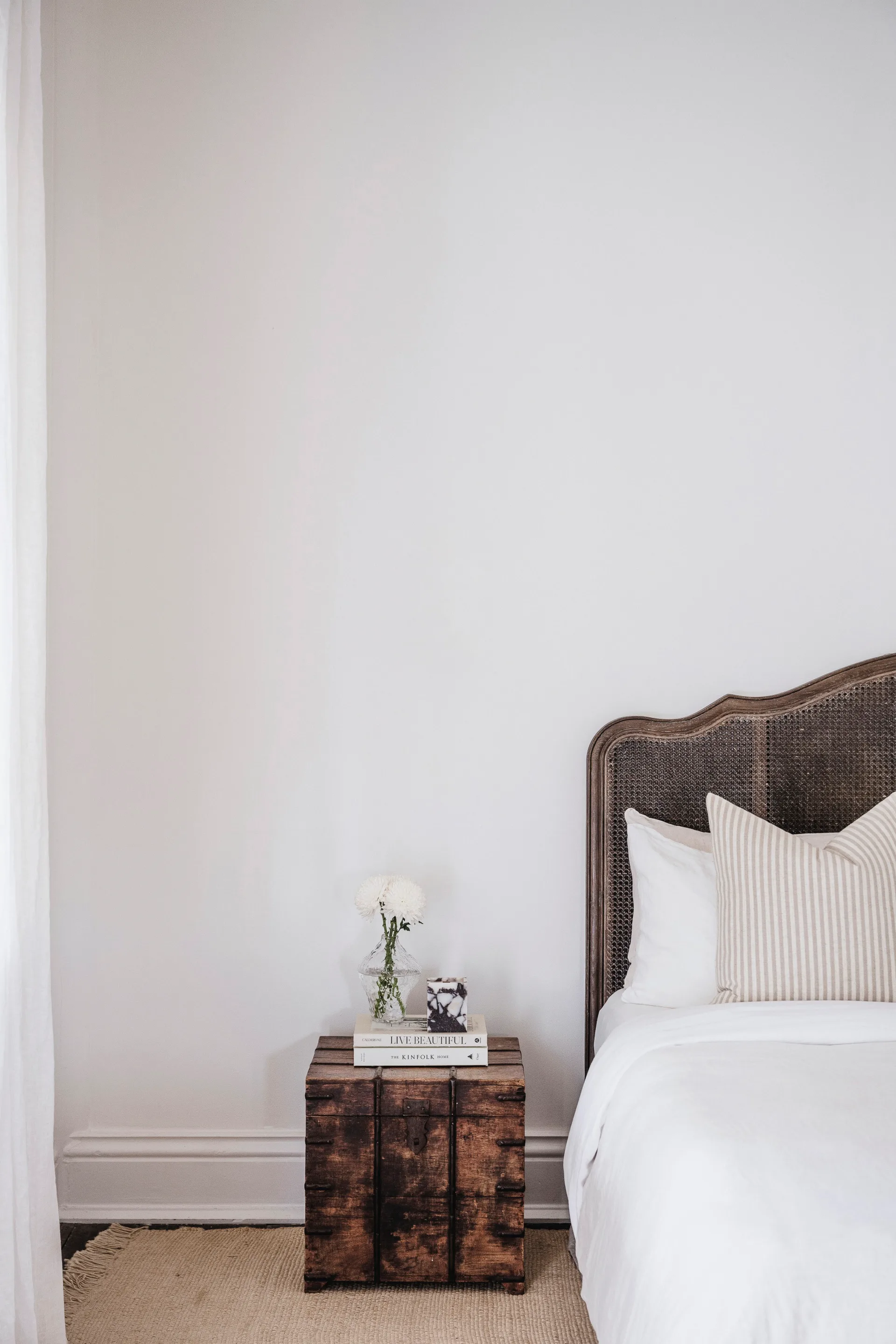 simple country style bedroom with timber bedside table