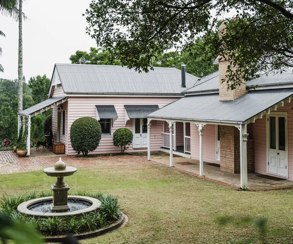pink weatherboard with landscaped garden