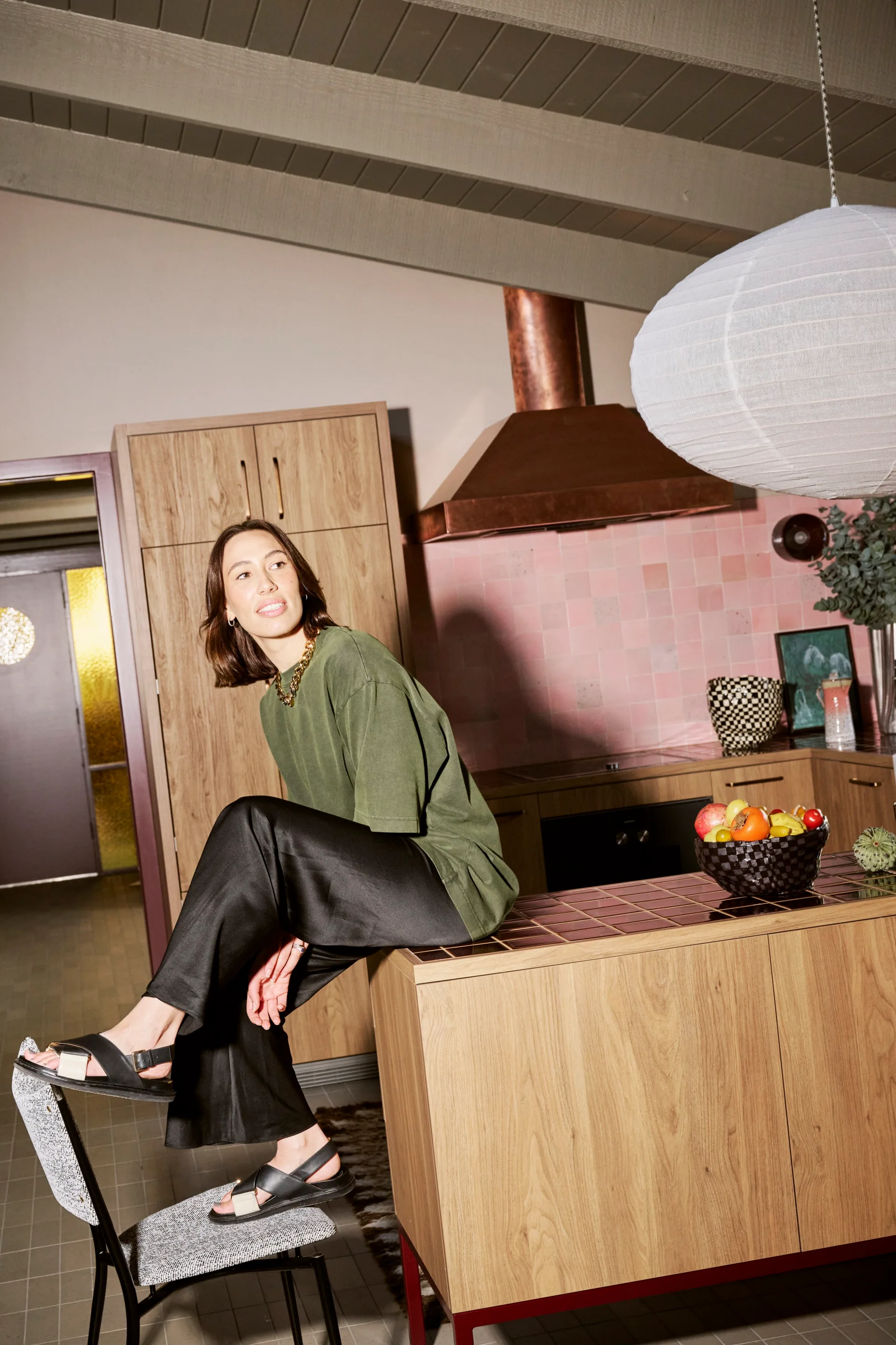 Cara Stizza in a pink and timber kitchen