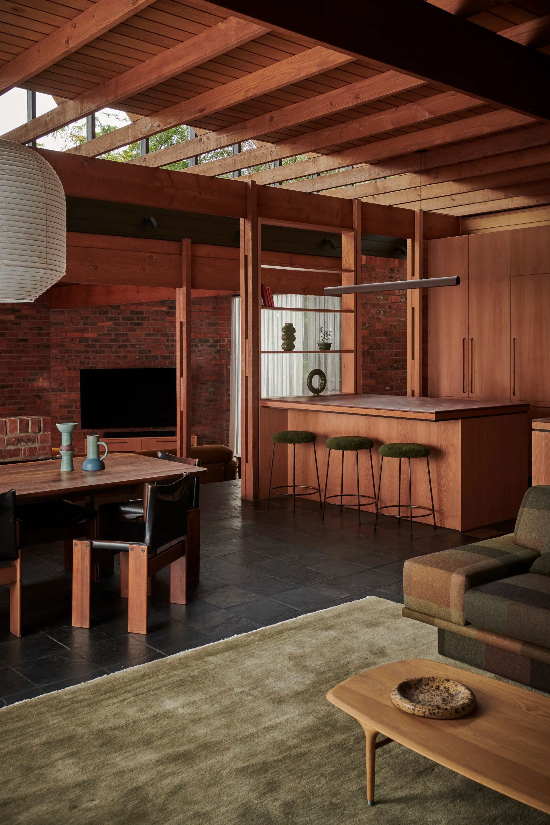 A 70s home with a timber kitchen and dining table