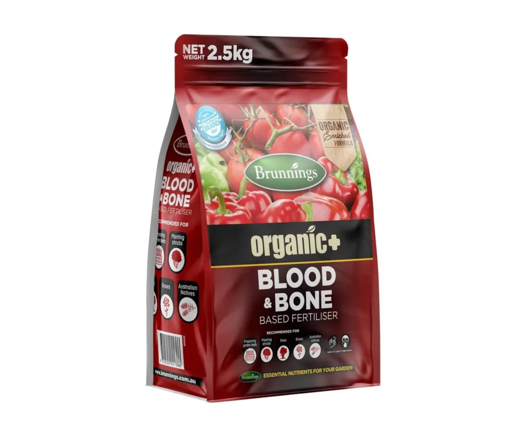 A dark red back of 'Blood and Bone' plant fertiliser. The bag reads 'Brunnings organic+ blood and bone based fertiliser'.