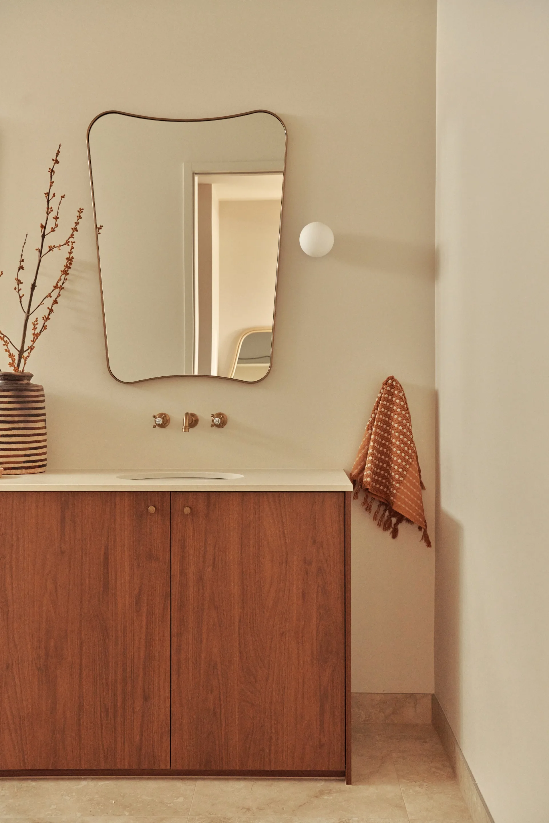 A modern ensuite with a wooden vanity and mirror