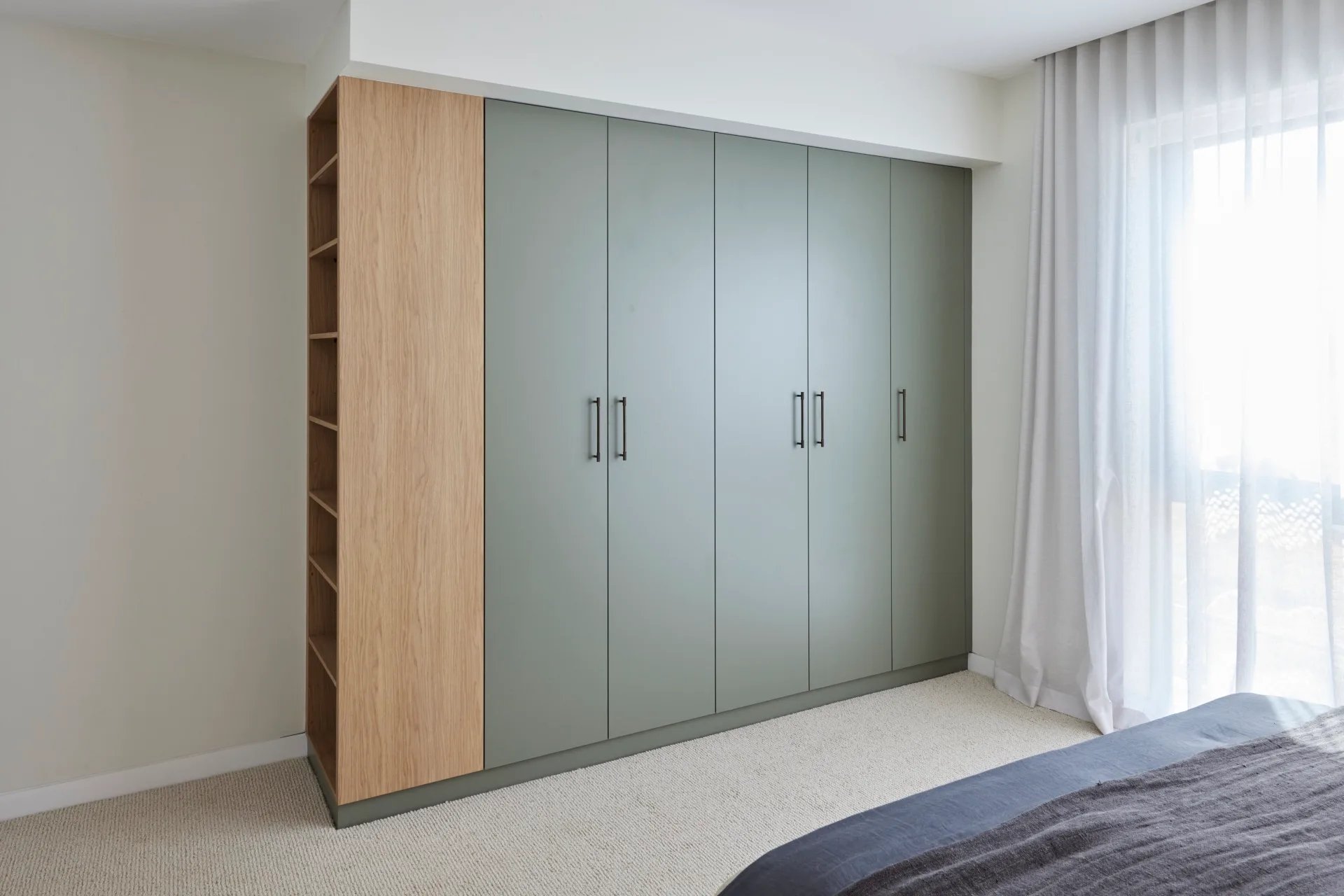 A green-toned wardrobe in the winning guest room of The Block 2024