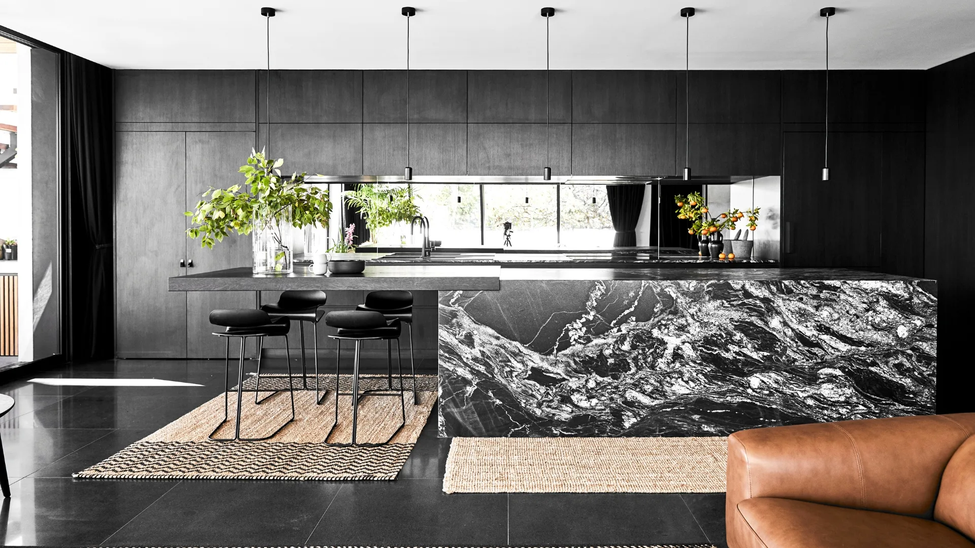 Shot of a dark, marbled kitchen