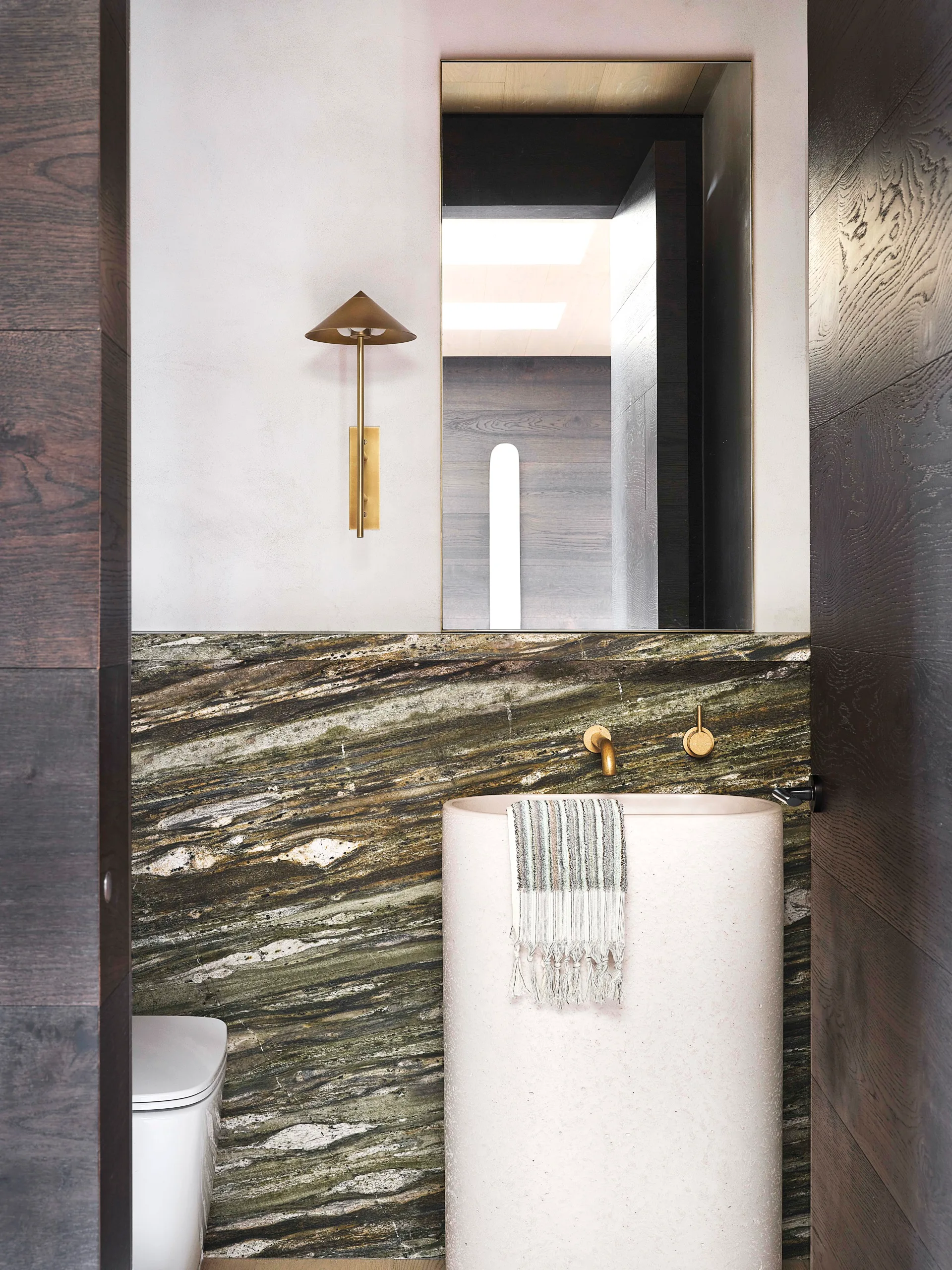 Moody materials in eye-popping shades - marble powder room