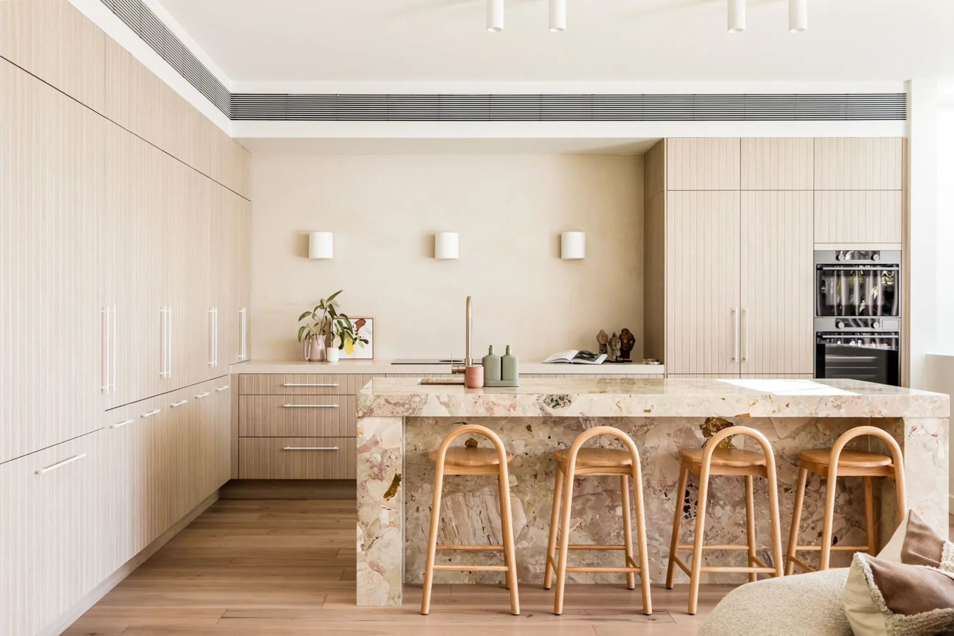 neutral kitchen with stone island bench