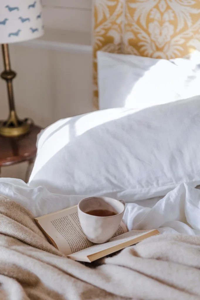 A white, country-style bedroom at Richmond Hill, Tasmania