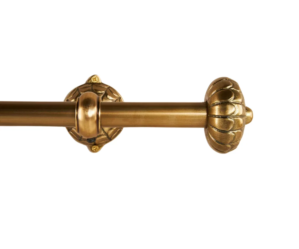 A gold, antique-look curtain rod