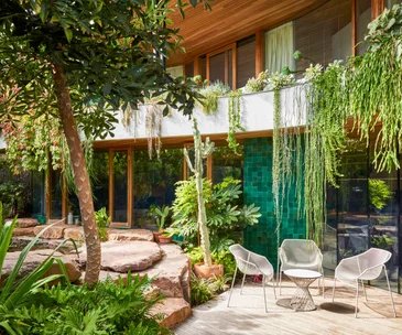 A decked area beside a rock-encased pond at a Barwon Heads home