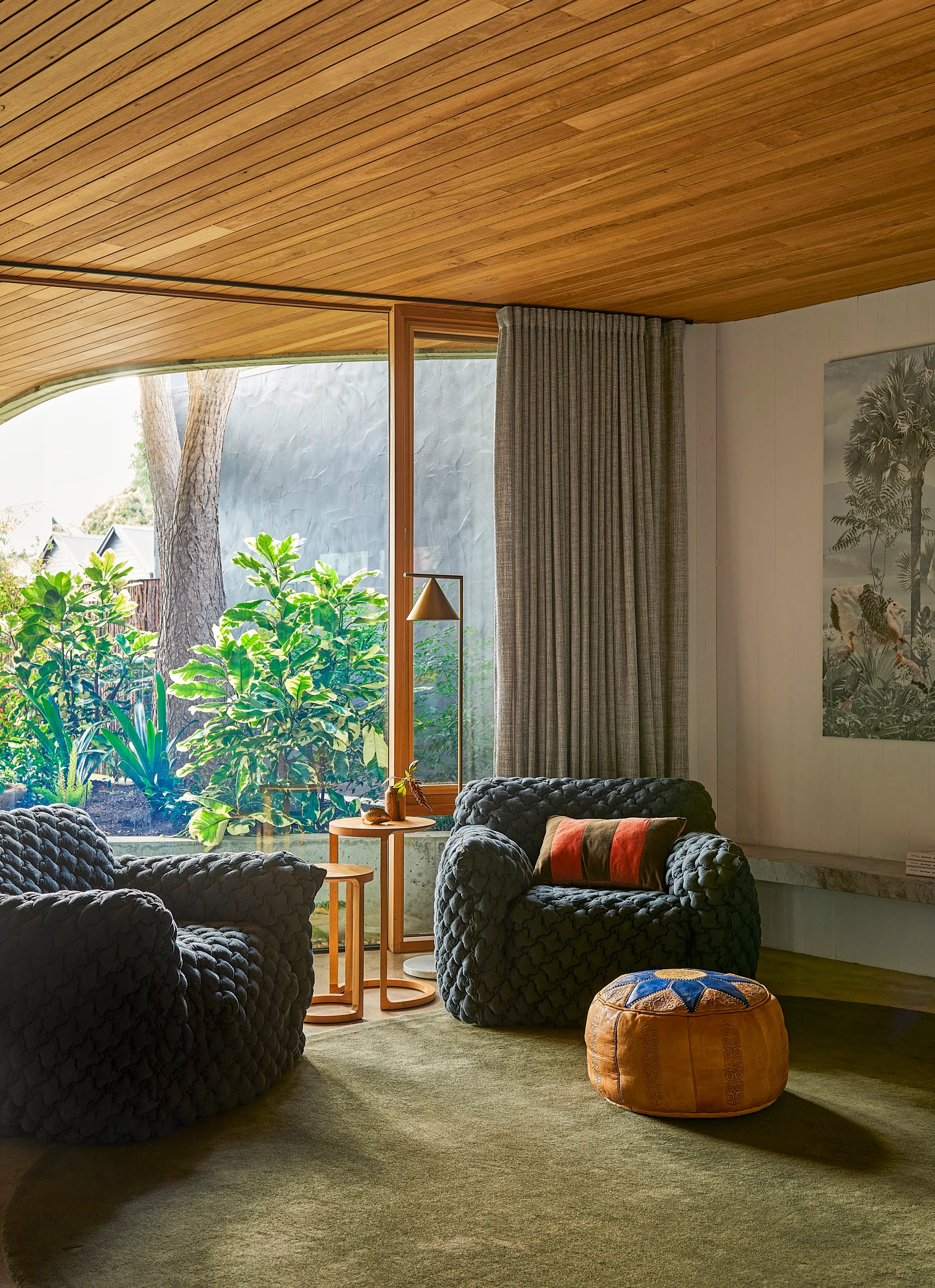 Navy armchairs in a lounge space