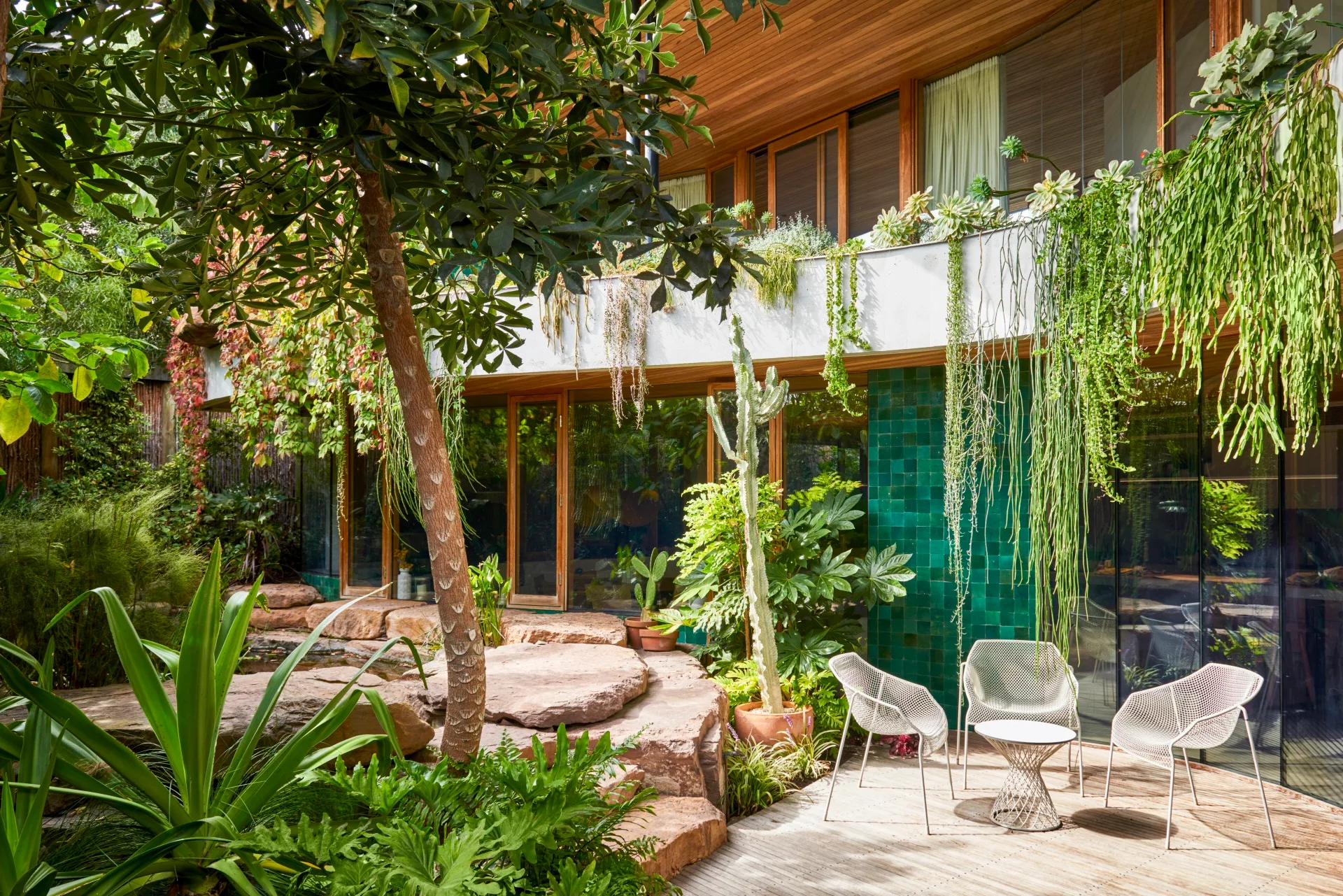 A decked area beside a rock-encased pond at a Barwon Heads home