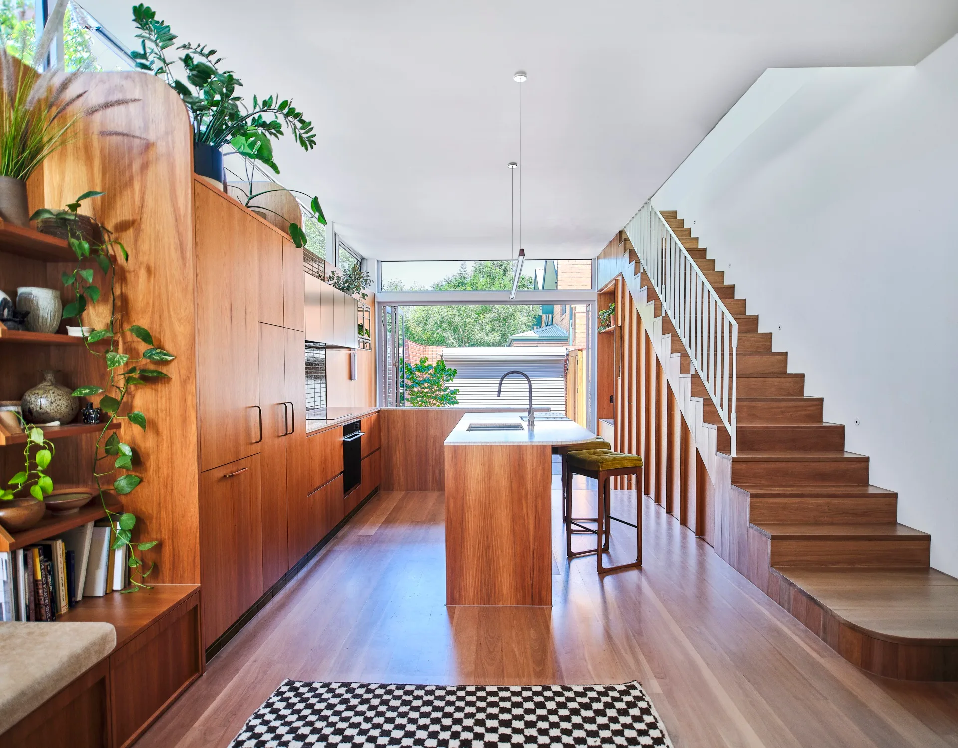 An all-timber kitchen with indoor plants