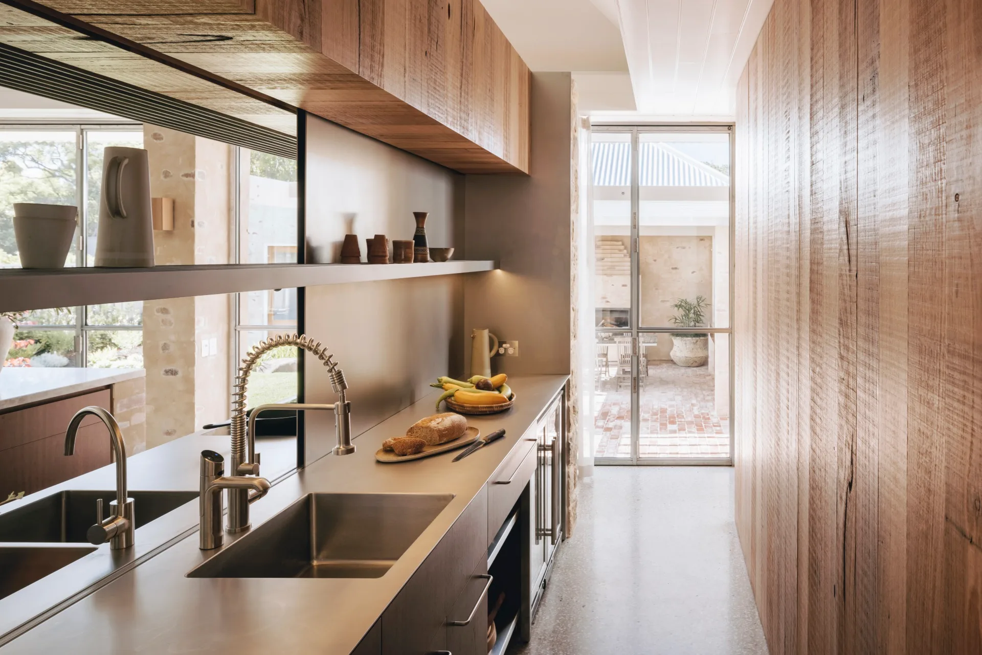 A modern butler's pantry with timber cabinetry