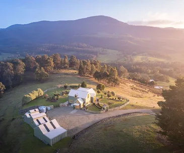 A storybook country home in regional Tasmania, set amongst rolling hills and paddocks.