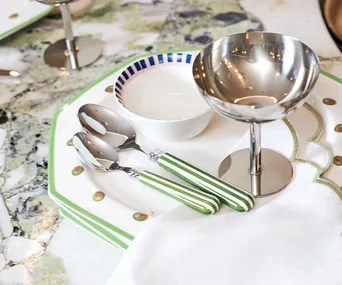 A table decorated with dinnerware from In The Roundhouse