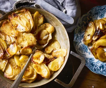 Potatoes boulangere in a a country style bowl