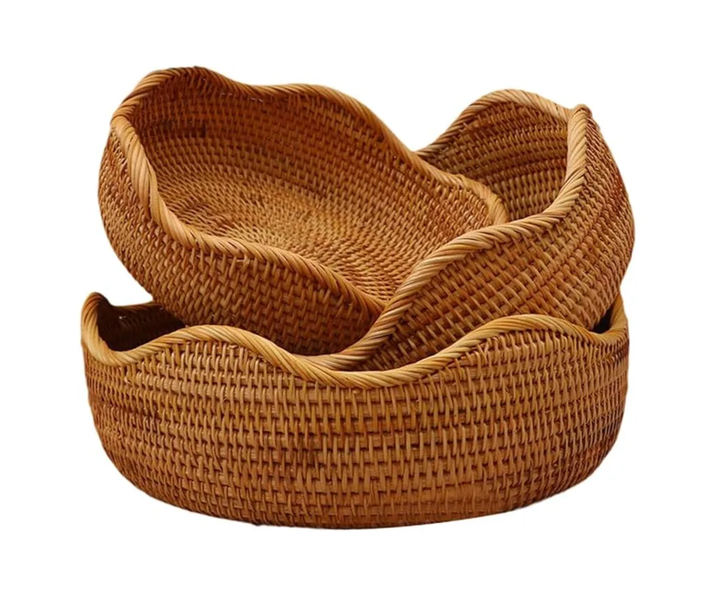 A set of 3 rattan serving baskets with wavy edges
