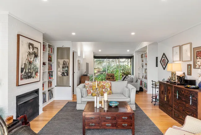 eclectic home living room with brick fireplace