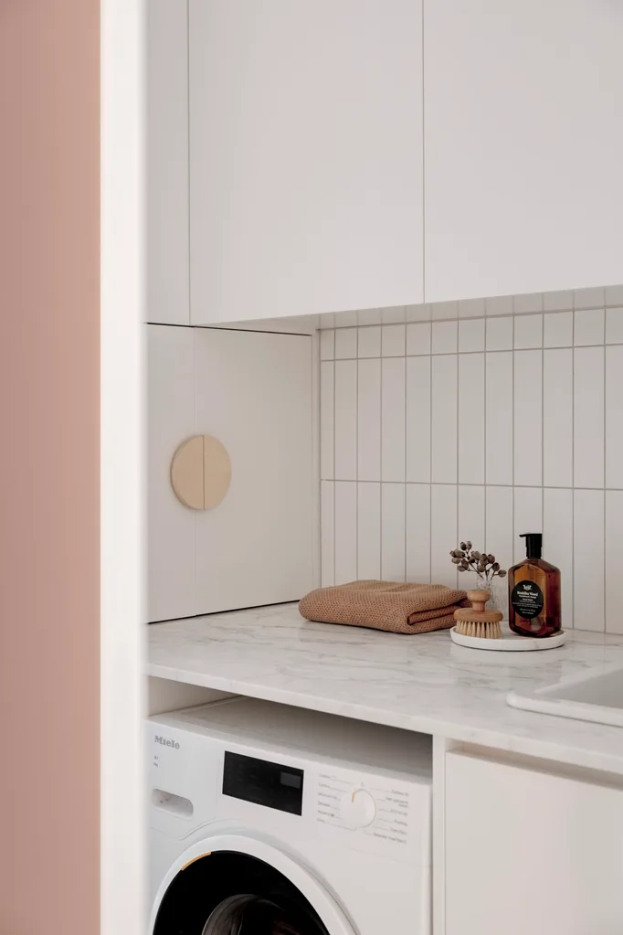 A laundry with marble benchtops