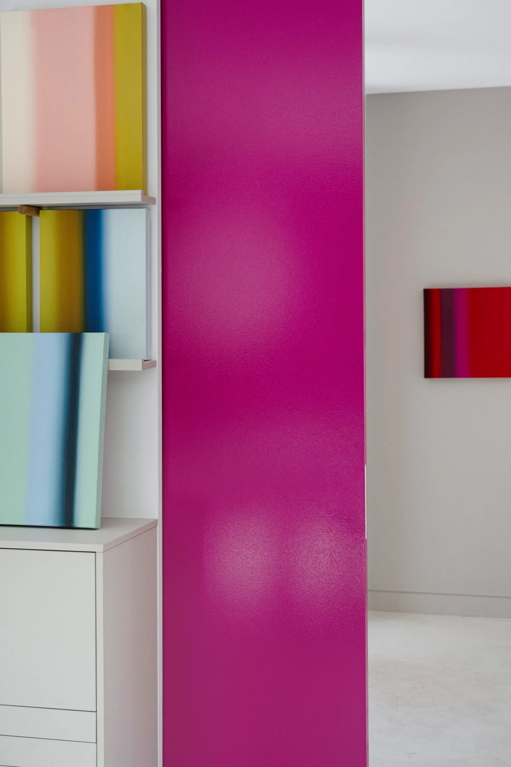 A pink door in a white space