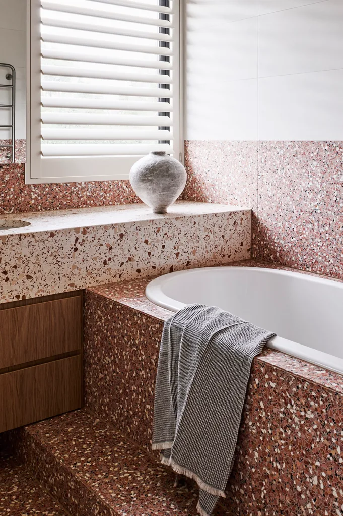 A built-in tub with terrazzo