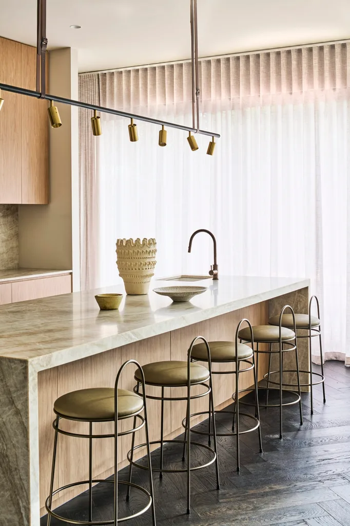 A contemporary kitchen with olive green accents