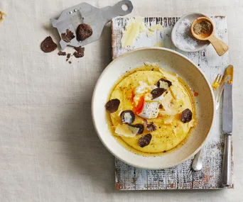 Poached eggs, polenta and truffle dish