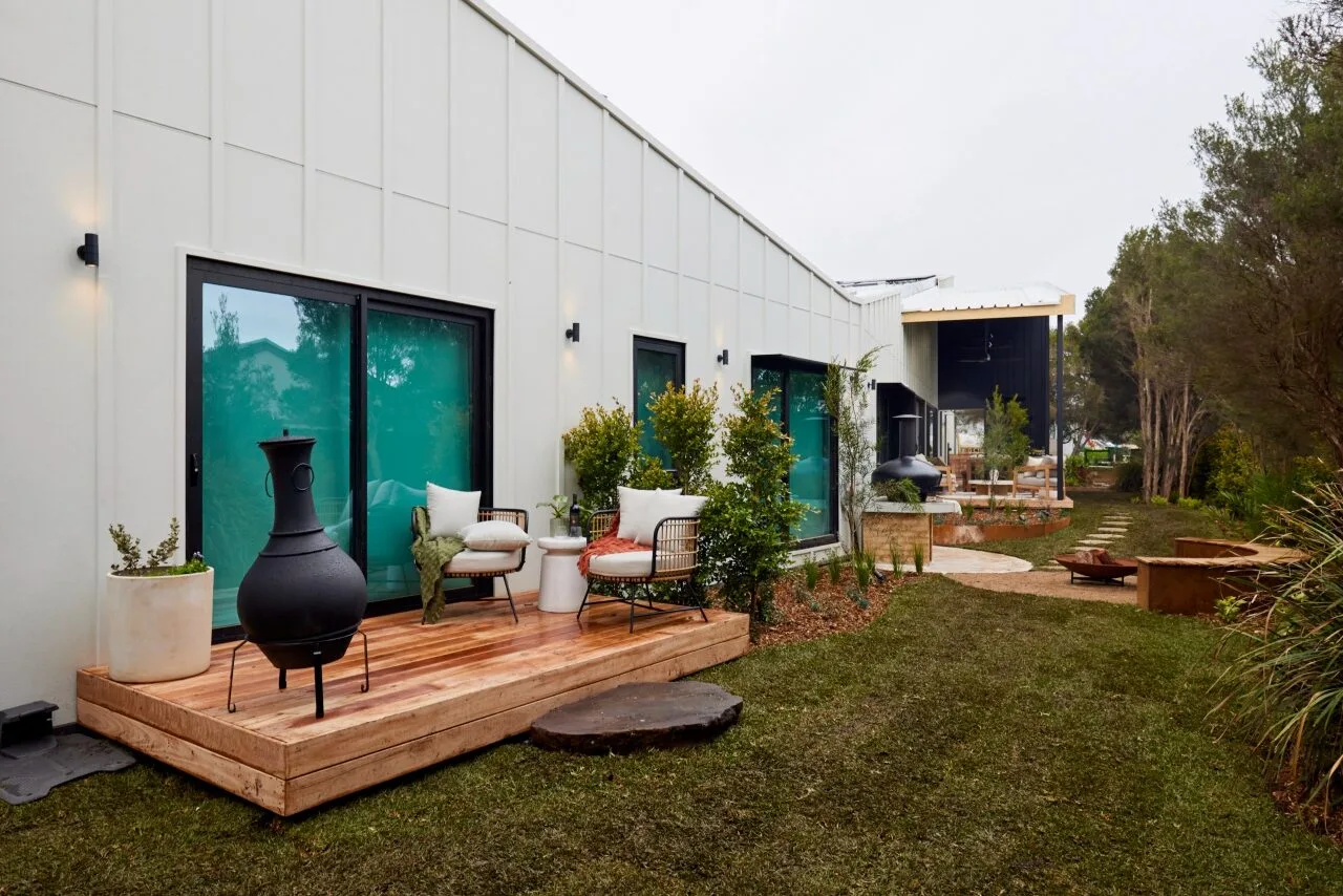 Maddy and Charlotte's outdoor area features a large lawn, a fire pit area and a small deck off the main bedroom.