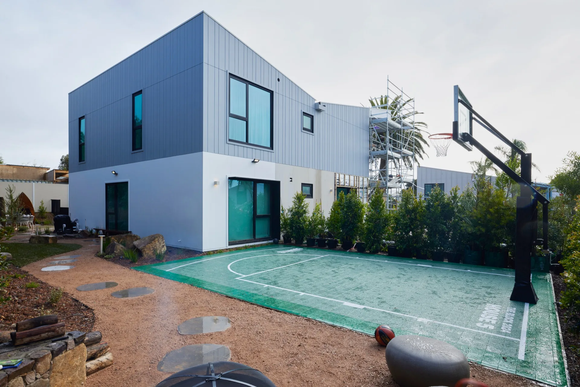 A small basketball court in the backyard of a house on The Block 2024.