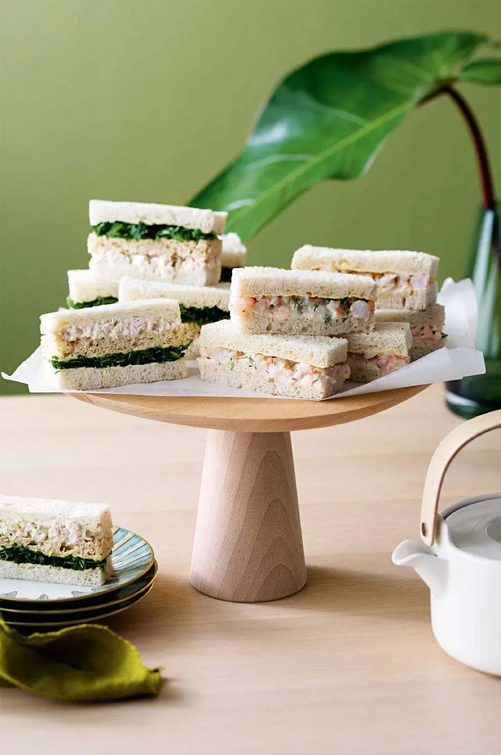 A cake stand with finger sandwiches