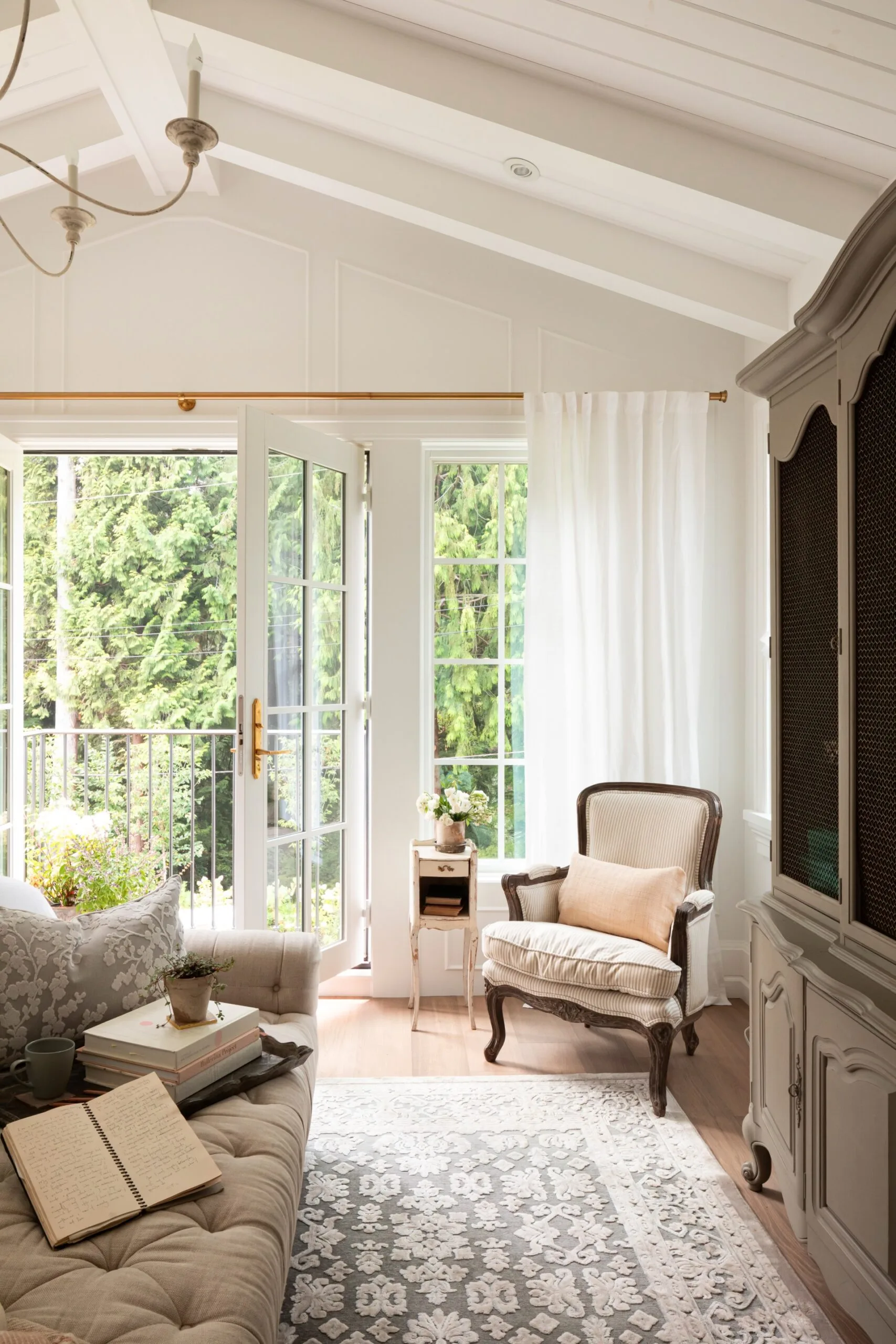 An upstairs living area with a reading nook and a balcony.