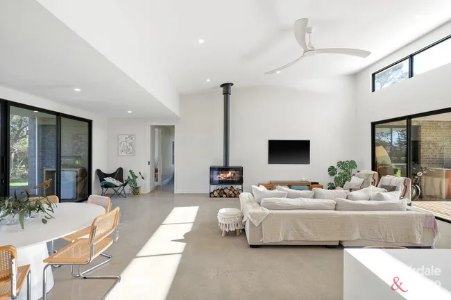 contemporary living room with concrete floor and fireplace