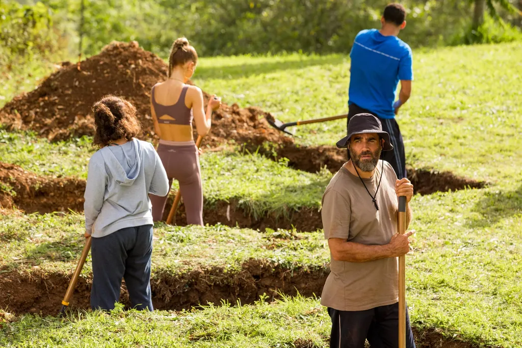 Four actors dig graves on the set of Nine Perfect Strangers, which is filmed at Soma in Byron Bay
