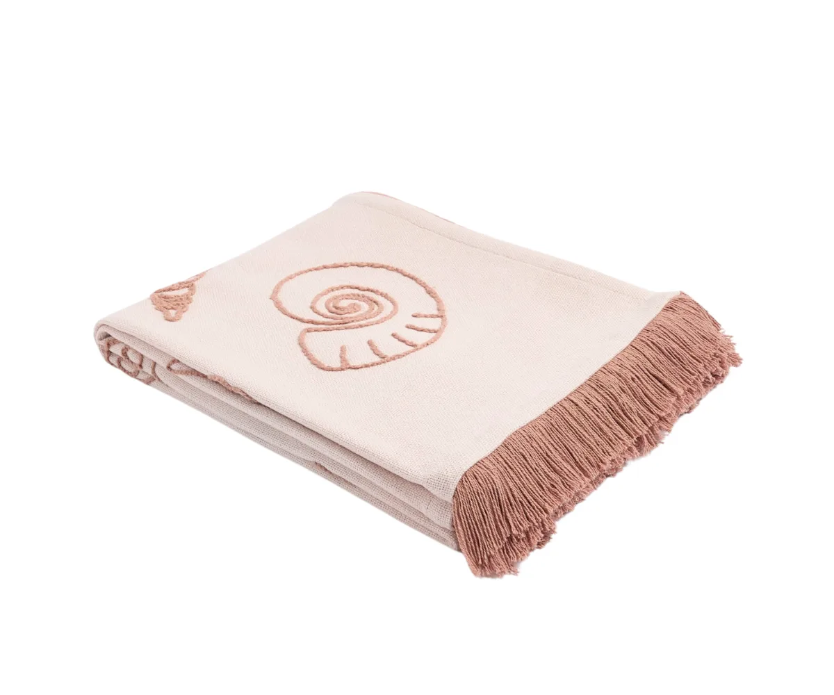 A pale pink embroidered throw