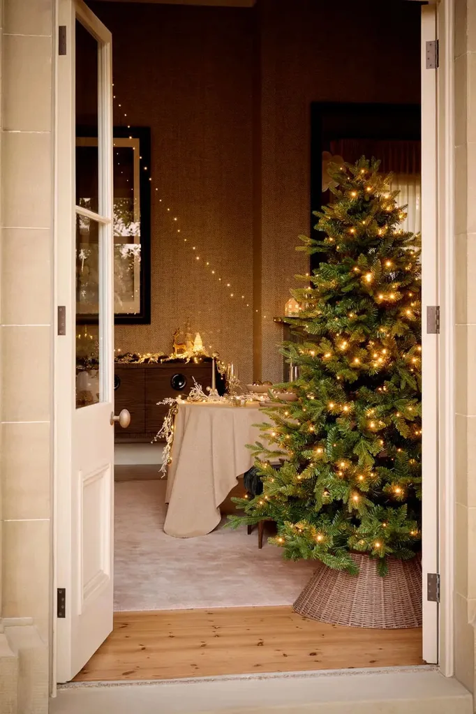 A door opens into a cosy home decorated with Bed Bath N' Table's latest Christmas collection