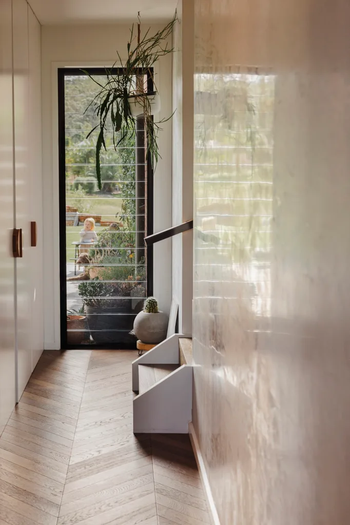 A hallway looking out onto a garden