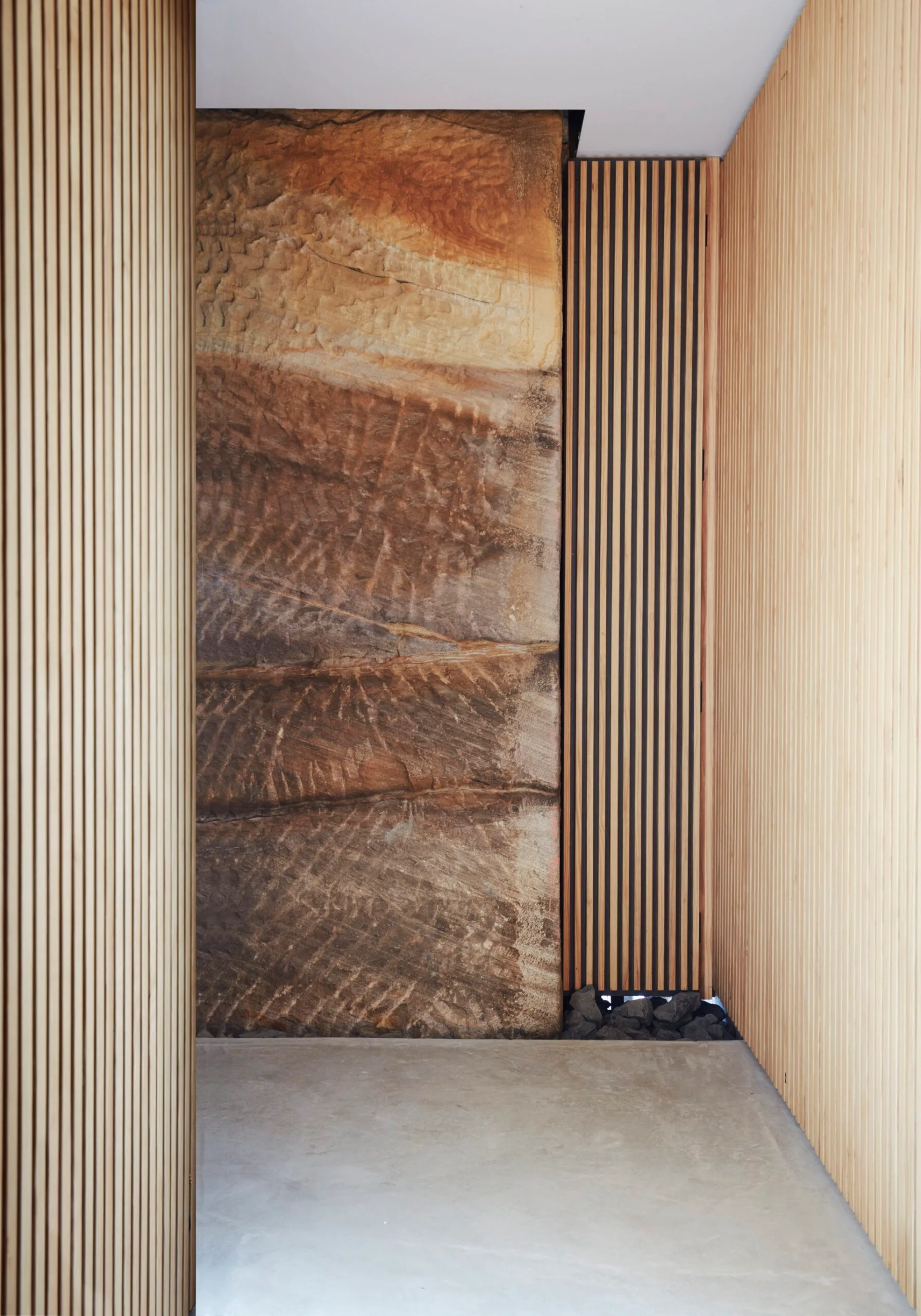 A hallway with stone and timber details