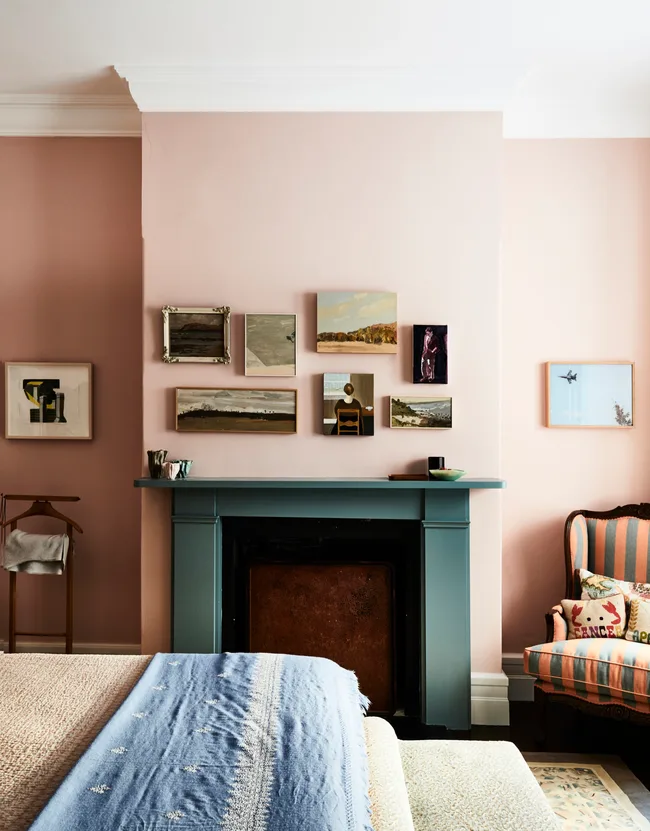 A pink bedroom with a gallery wall in No Chintz's Chrissie Jeffery's home