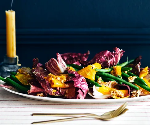 A crisp green bean salad with radicchio, walnut & orange dressing