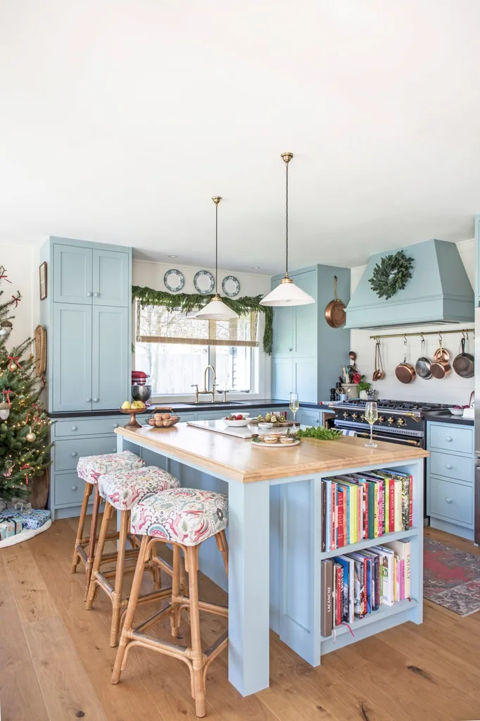 A blue kitchen decorated with festive decor