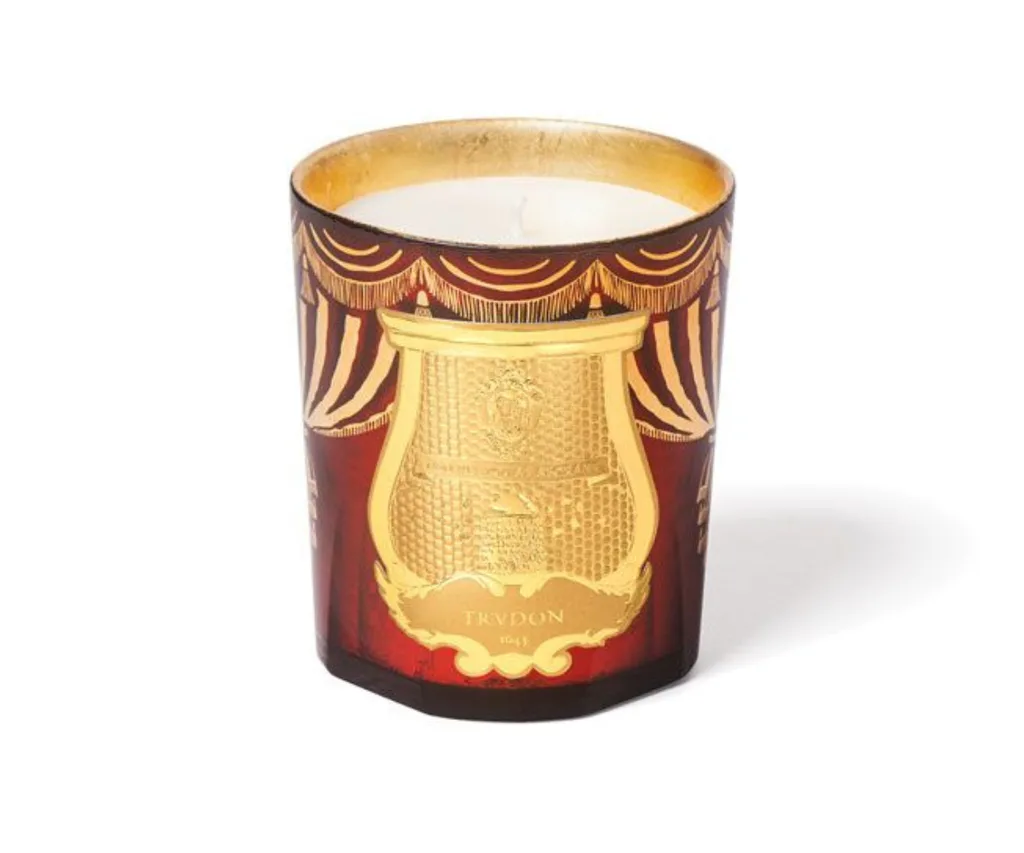 Trudon's red and gold Christmas candle