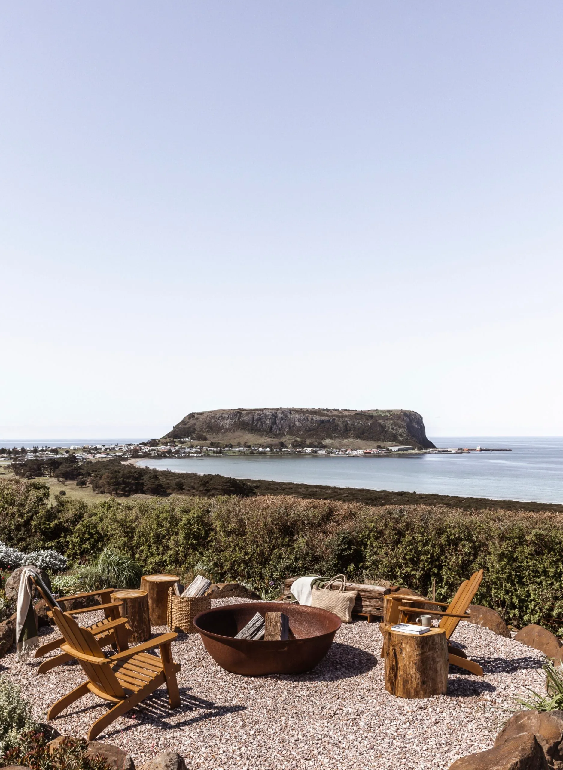 A fire pit area with a view out to The Nut in Stanley, Tasmania