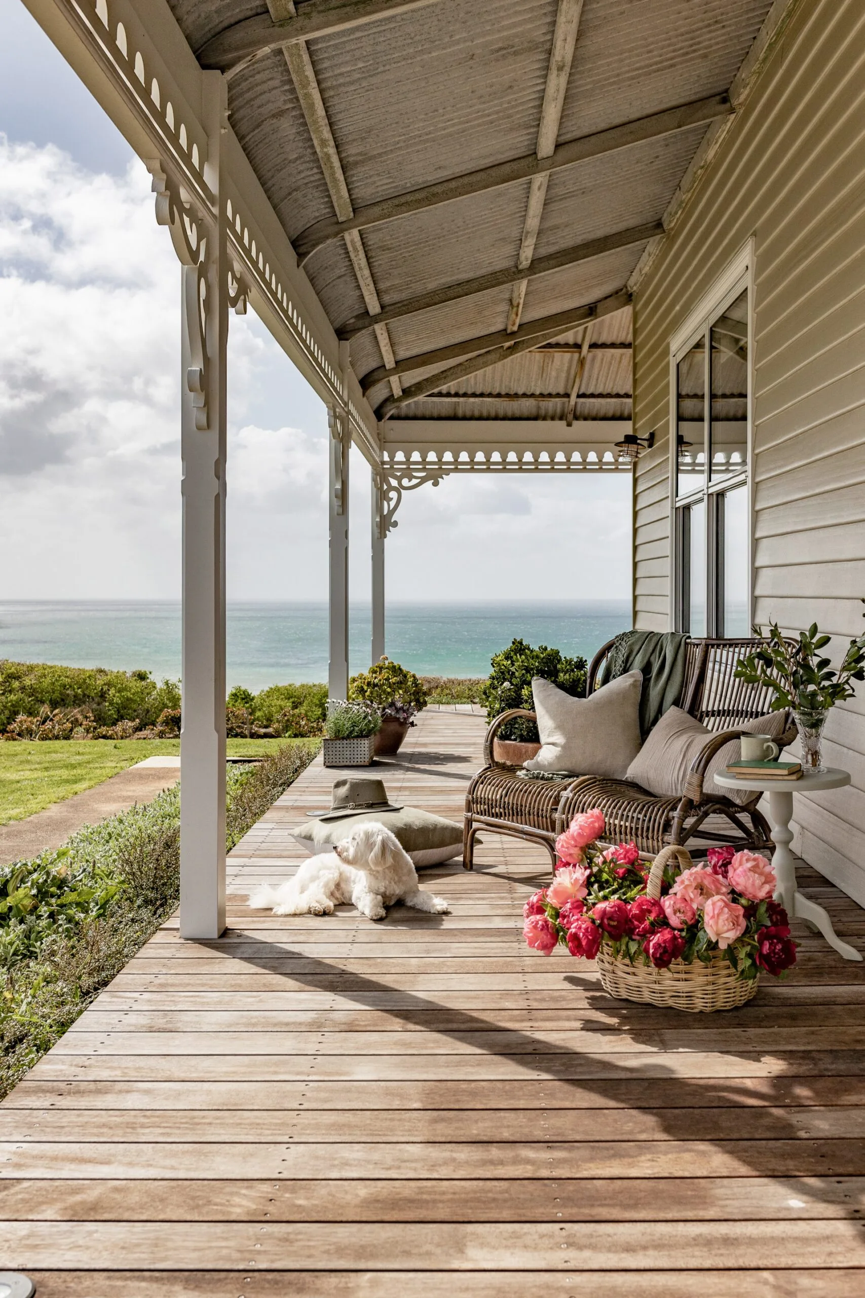 The exterior of a weatherboard house with a wraparound balcony