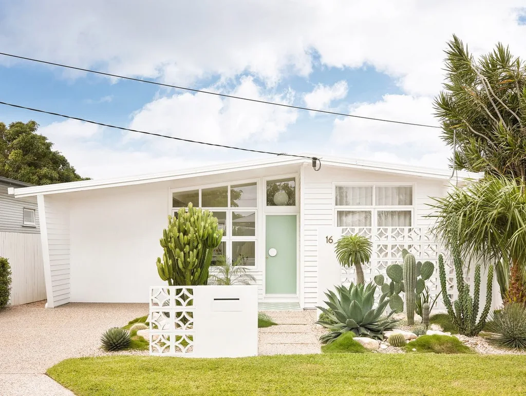 An all-white mid-century style home