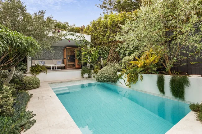 A swimming pool with an adjoining cabana